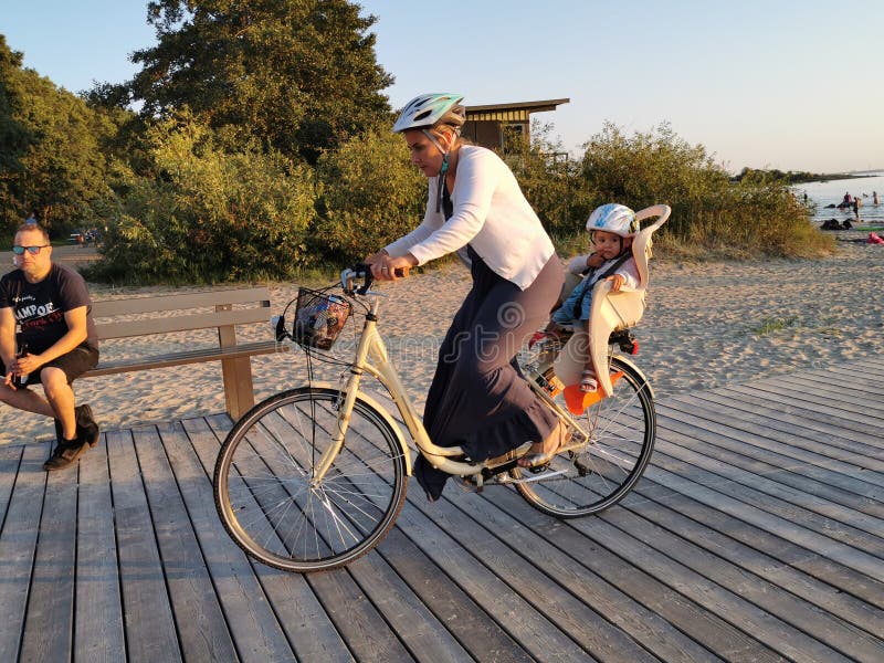 Tallinn, Estonia - 09.2019. silhouettes of a Bicycle against the sunset on the sea. Adults and children Cycling royalty free stock photo Tallinn, Estonia - 09.2019. silhouettes of a Bicycle against the sunset on the sea. Adults and children Cycling royalty free stock photo