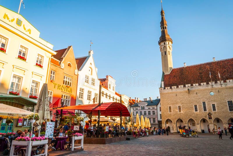 TALLINN, ESTONIA - AUGUST 17: Medieval market in front of Tallinn city hall on old town square in morning sun. August 2015. TALLINN, ESTONIA - AUGUST 17: Medieval market in front of Tallinn city hall on old town square in morning sun. August 2015