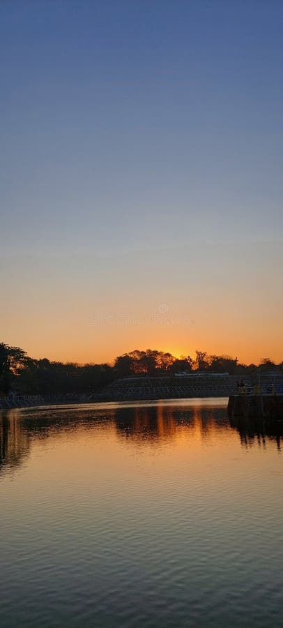 Tambakboyo Reservoir, a hidden gem spot in Jogja to enjoy epic sunsets & chill twilight vibes. royalty free stock photo