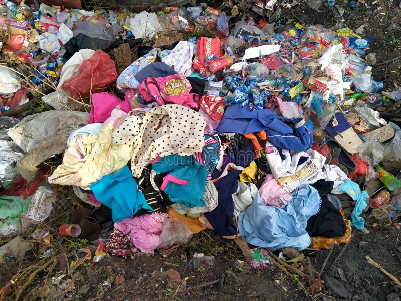 Tambun, Bekasi, Indonesia - October 12, 2020 : Clothing waste that is thrown in the trash. Tambun, Bekasi, Indonesia - October 12, 2020 : Clothing waste that is thrown in the trash