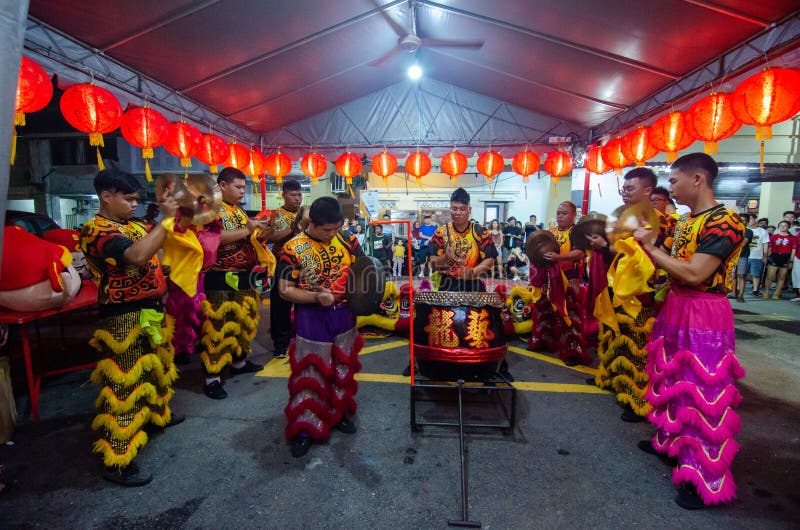 Georgetown, Penang/Malaysia - Jan 24 2020: Lion dance drummer beat drum. Georgetown, Penang/Malaysia - Jan 24 2020: Lion dance drummer beat drum.