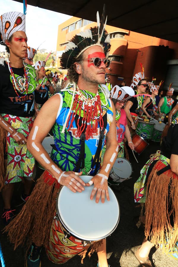 Drummer in a colorful costume at the 2023 Notting Hill Carnival in west London. Drummer in a colorful costume at the 2023 Notting Hill Carnival in west London.