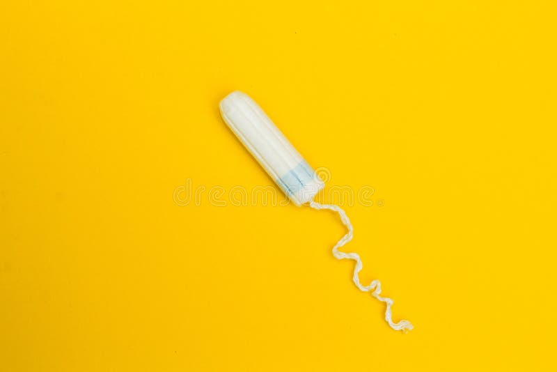 Tampon op een gele achtergrond stock foto's Tampon op een gele achtergrond stock foto's