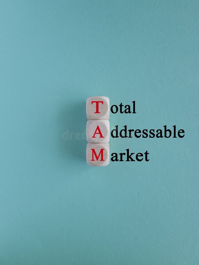 TAM total addressable market symbol. Concept red words TAM total addressable market on wooden cubes on beautiful blue background. Business TAM total addressable market concept. Copy space. TAM total addressable market symbol. Concept red words TAM total addressable market on wooden cubes on beautiful blue background. Business TAM total addressable market concept. Copy space