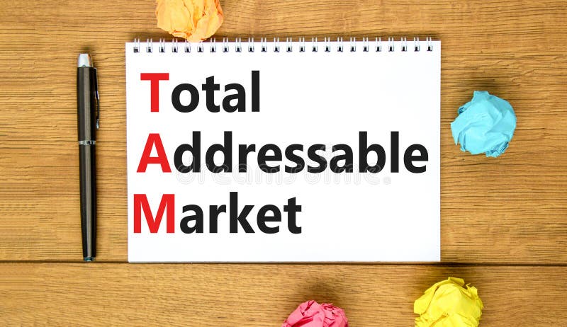 TAM total addressable market symbol. Concept words TAM total addressable market on white note on a beautiful wooden background. Business TAM total addressable market concept. Copy space. TAM total addressable market symbol. Concept words TAM total addressable market on white note on a beautiful wooden background. Business TAM total addressable market concept. Copy space