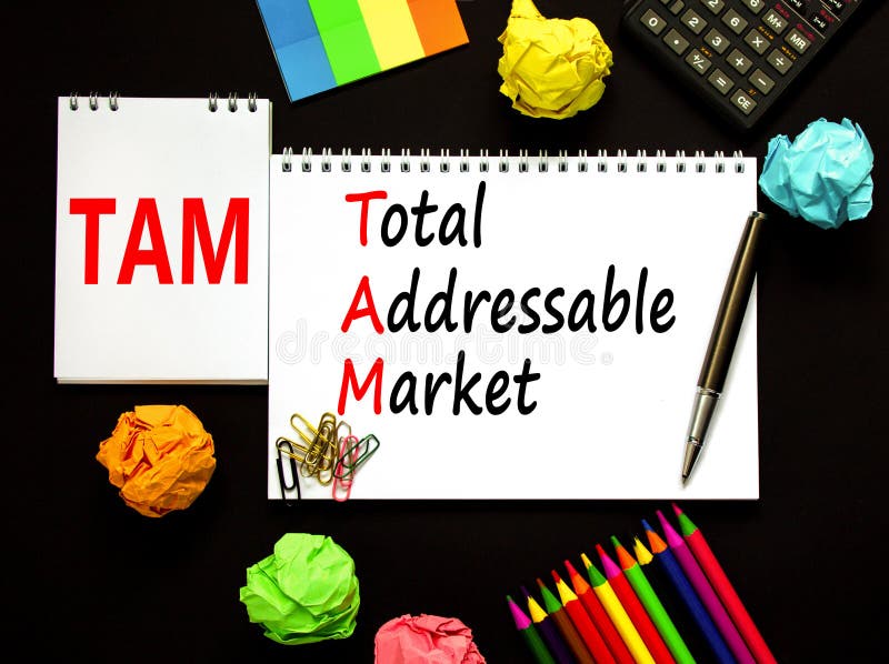 TAM total addressable market symbol. Concept words TAM total addressable market on white note on a beautiful black background. Calculator. Business TAM total addressable market concept. Copy space. TAM total addressable market symbol. Concept words TAM total addressable market on white note on a beautiful black background. Calculator. Business TAM total addressable market concept. Copy space