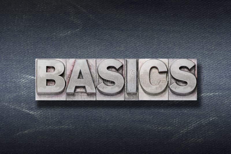 Basics word made from metallic letterpress on dark jeans background. Basics word made from metallic letterpress on dark jeans background