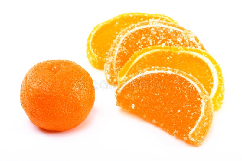 Tangerine and fruit candy segments on a white back