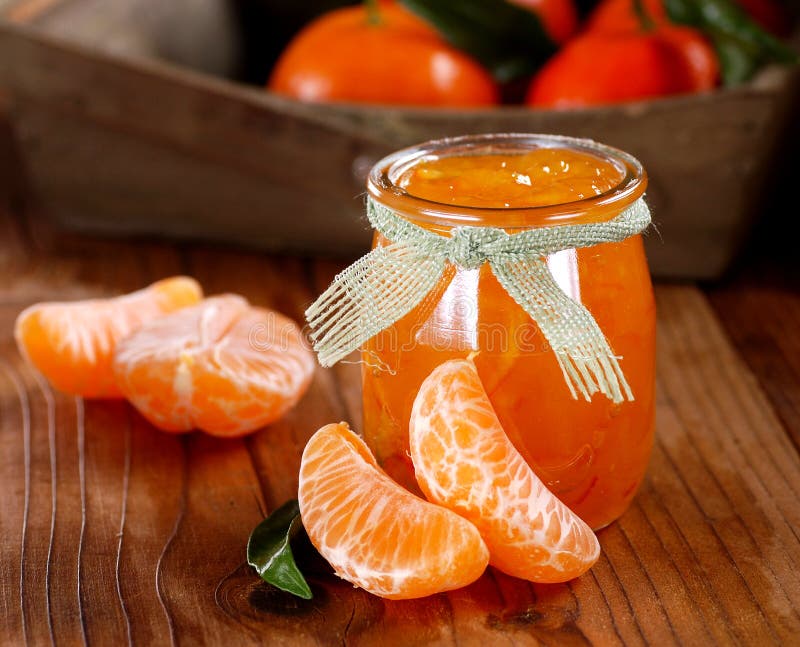 Tangerine jam in glass jar stock images Tangerine jam in glass jar stock images
