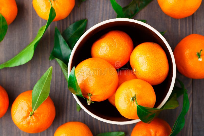 Tangerines on wooden background