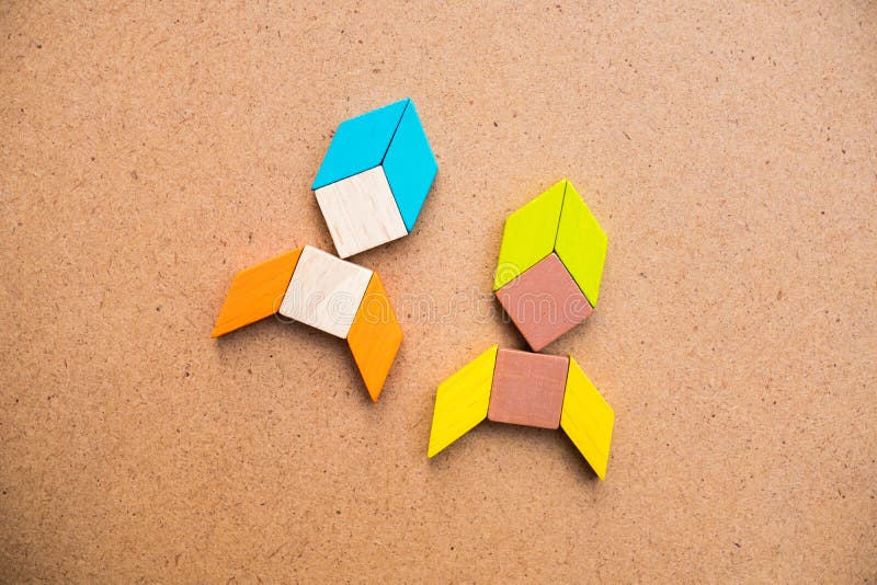 Tangram puzzle couple rocket shape on wooden background use for royalty free stock image