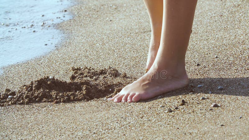 Tanned Female Legs On Beach Water Splashing On Feet In Ocean On Sandy Beach Stock Footage