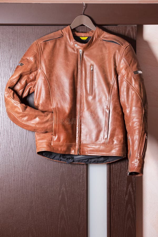 Tanned Leather Stylish Motorcyclist Jacket Hinged Over Sliding Door ...
