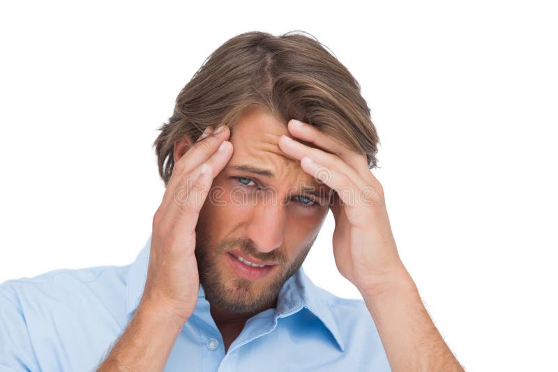Tanned man having a strong headache royalty free stock images
