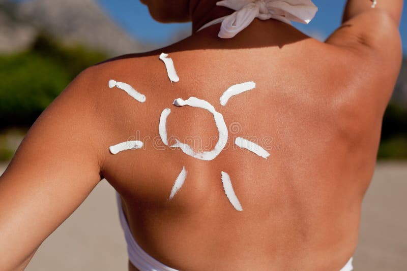 Tanning lotion on woman s shoulder.