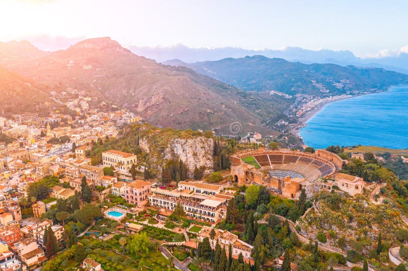 Taormina theater, amphitheater, arena is a town on the island of Sicily, Italy. Aerial view from above in the evening sunset stock photos Taormina theater, amphitheater, arena is a town on the island of Sicily, Italy. Aerial view from above in the evening sunset stock photos