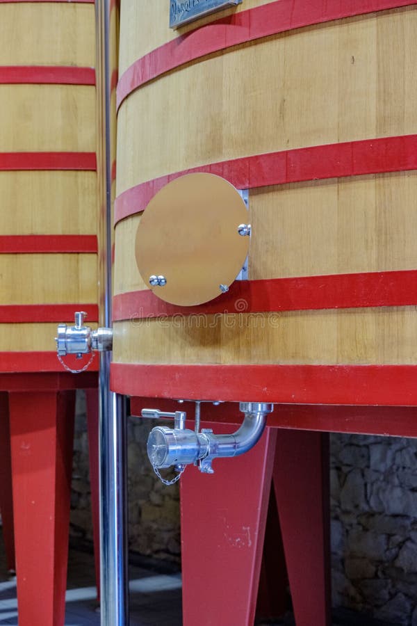 Tap and part of the structure of a large barrel where it starts to ferment grape wine to become royalty free stock photos Tap and part of the structure of a large barrel where it starts to ferment grape wine to become royalty free stock photos