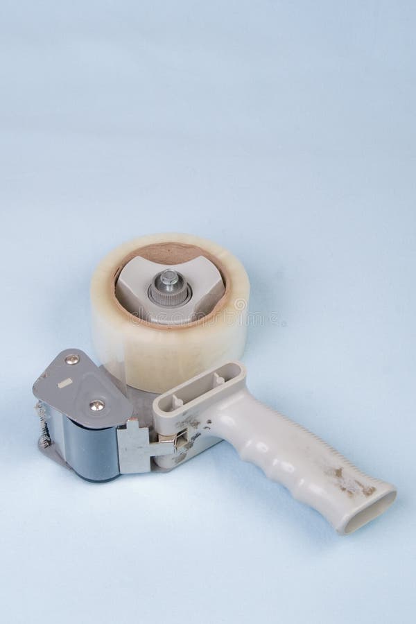 Tape Gun on Light Blue stock image. Image of packing 10926887
