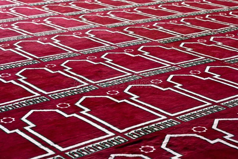 Tapete praying islâmico vermelho no teste padrão foto de stock royalty free Tapete praying islâmico vermelho no teste padrão foto de stock royalty free