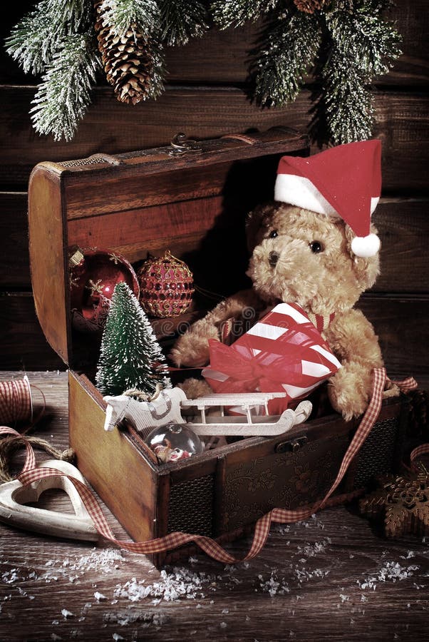 Vintage chest with old christmas decorations and toys on wooden background. Vintage chest with old christmas decorations and toys on wooden background