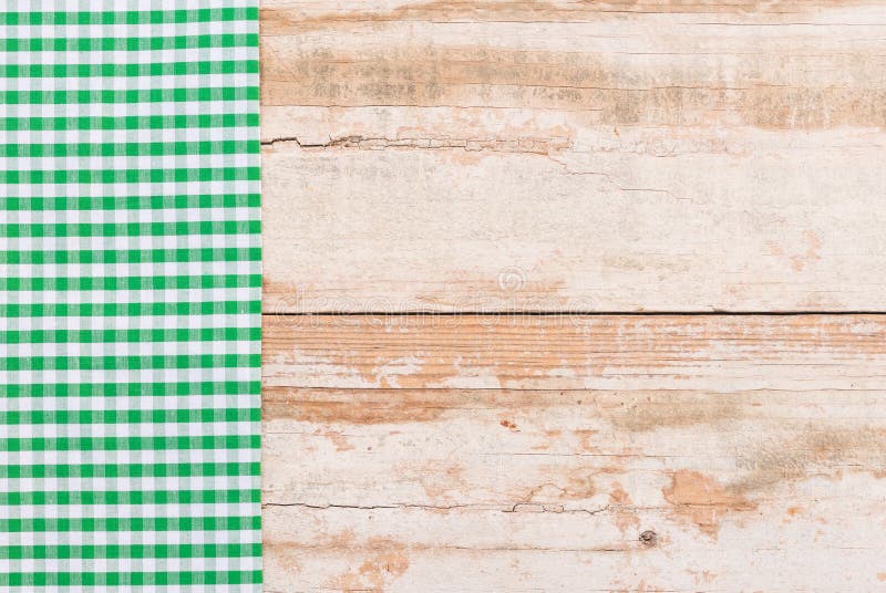 Tappningköksbordbakgrund med gräsplan kontrollerade picknickbordduken royaltyfri bild Tappningköksbordbakgrund med gräsplan kontrollerade picknickbordduken royaltyfri bild