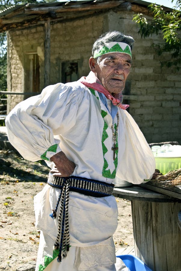 Tarahumara medicine man and healer, an indigenous native person in the Copper Canyon of the Sierra Madre mountains in Mexico, is wearing traditional clothing as he prepares his herbs. Tarahumara medicine man and healer, an indigenous native person in the Copper Canyon of the Sierra Madre mountains in Mexico, is wearing traditional clothing as he prepares his herbs.