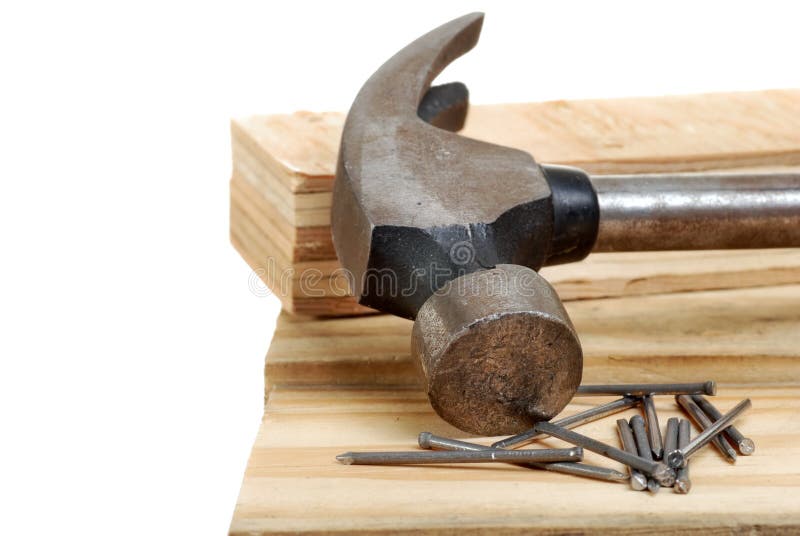 Isolated hammer with lumber and nails on white background. Isolated hammer with lumber and nails on white background