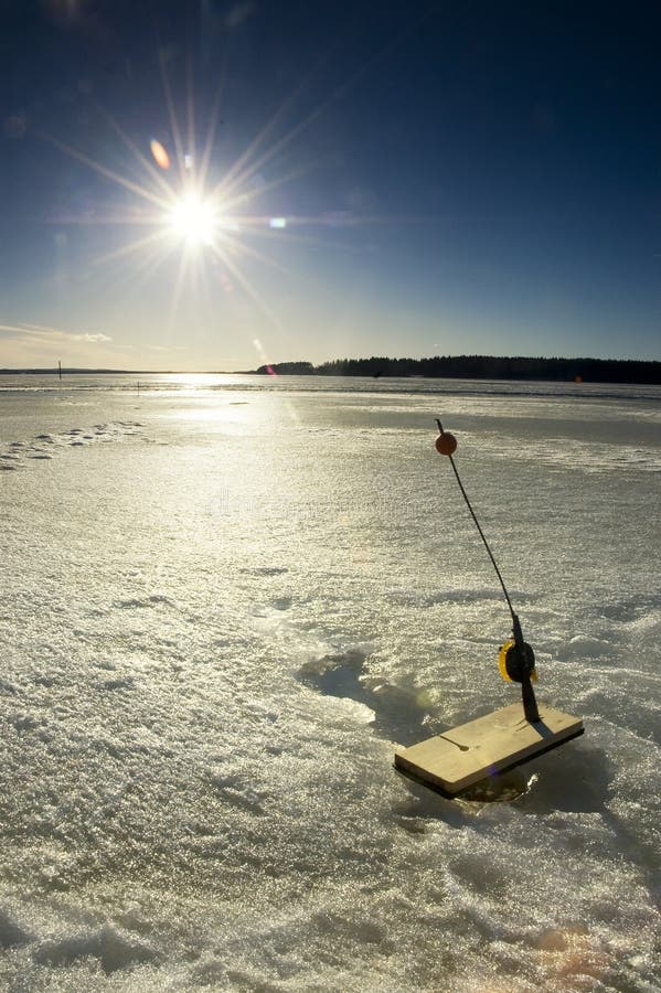 Ice fishing on frozen lake in Finland, Iisalmi. Ice fishing on frozen lake in Finland, Iisalmi