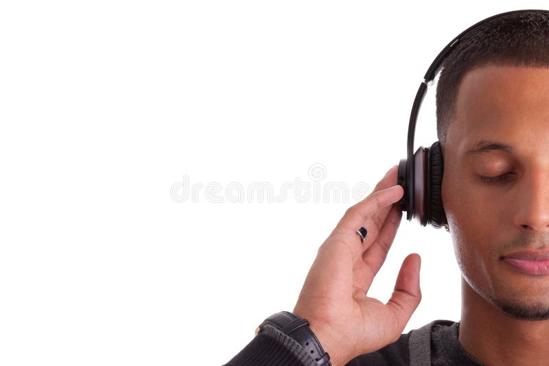 Young black man with closed eyes listening to music, isolated on white background. Young black man with closed eyes listening to music, isolated on white background