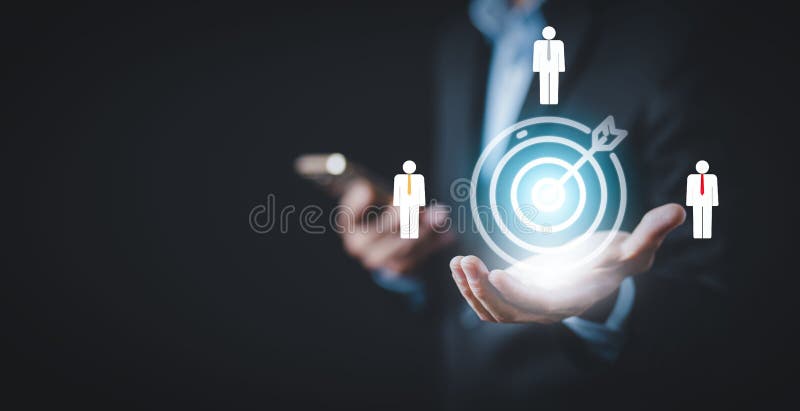 Targeting the business and human concept, Businessman holding arrow dart to virtual target dart board,Executive marketing royalty free stock photo