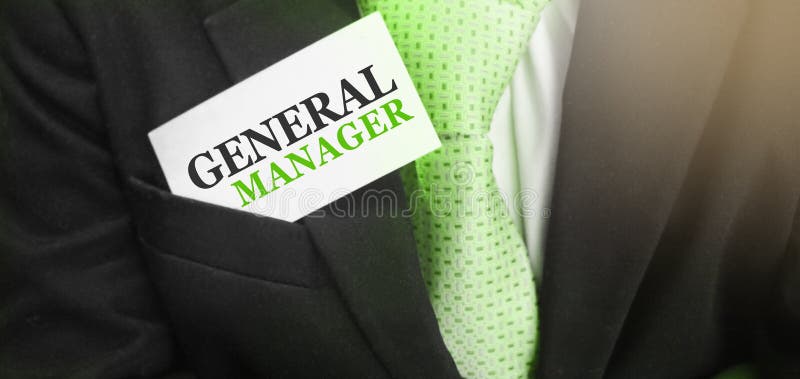 Card with text GENERAL MANAGER in upper pocket of businessman suit. Business concept. Selective soft focus . Card with text GENERAL MANAGER in upper pocket of businessman suit. Business concept. Selective soft focus .