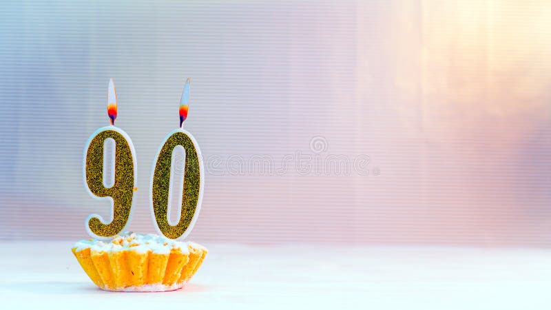 Happy birthday card from candles with the number  90, golden numbers from candles for congratulations on any holiday. Happy birthday card from candles with the number  90, golden numbers from candles for congratulations on any holiday