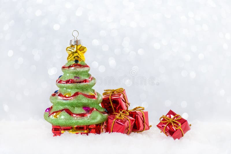 Christmas background with tree and gifts in snow, bokeh. Christmas background with tree and gifts in snow, bokeh