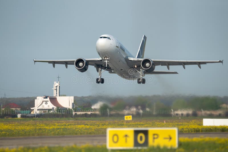 Tarom Timisoara Skyteam commercial airplane takeoff from Otopeni airport in Bucharest Romania