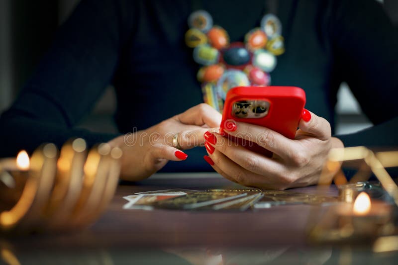 Tarot Card Reader Arranges Cards in a Card Spread.