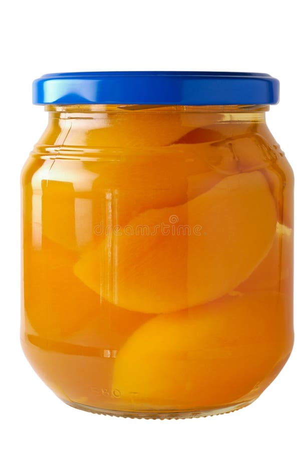 Tarro de cristal de melocotones preservados fotografía de archivo Tarro de cristal de melocotones preservados fotografía de archivo