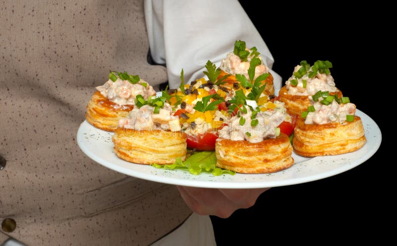 Tartlets with salad on dish royalty free stock photography Tartlets with salad on dish royalty free stock photography