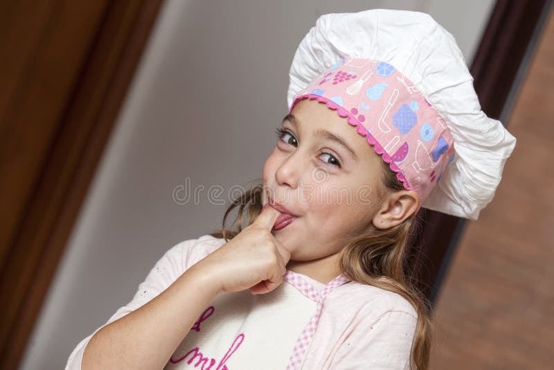 Girl Tasting Cupcakes Dough Stock Photos Free & RoyaltyFree Stock