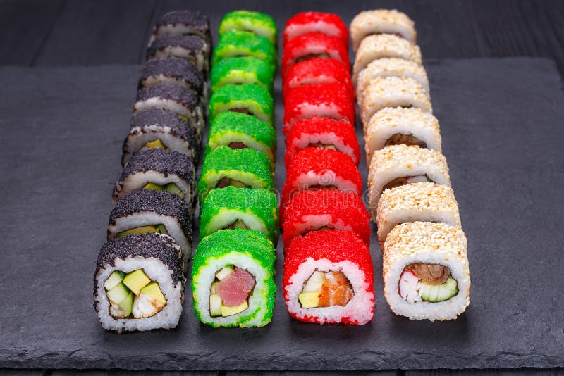 Tasty appetizing multicolored uramaki sushi rolls set with wide royalty free stock photos Tasty appetizing multicolored uramaki sushi rolls set with wide royalty free stock photos