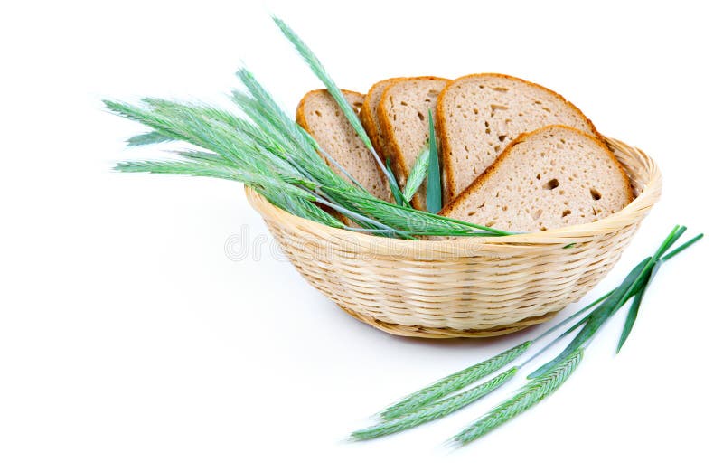 Tasty baked bread with ears of wheat