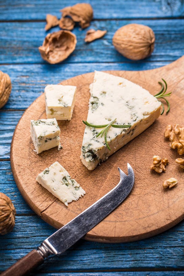 Blue cheese with nuts stock photo. Image of roquefort 62857614