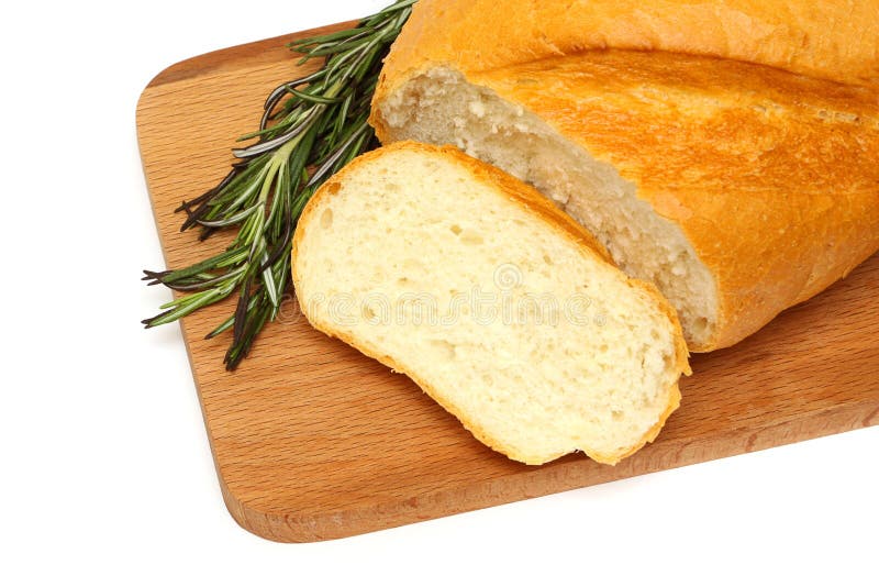 Tasty bread and herb on a wooden board