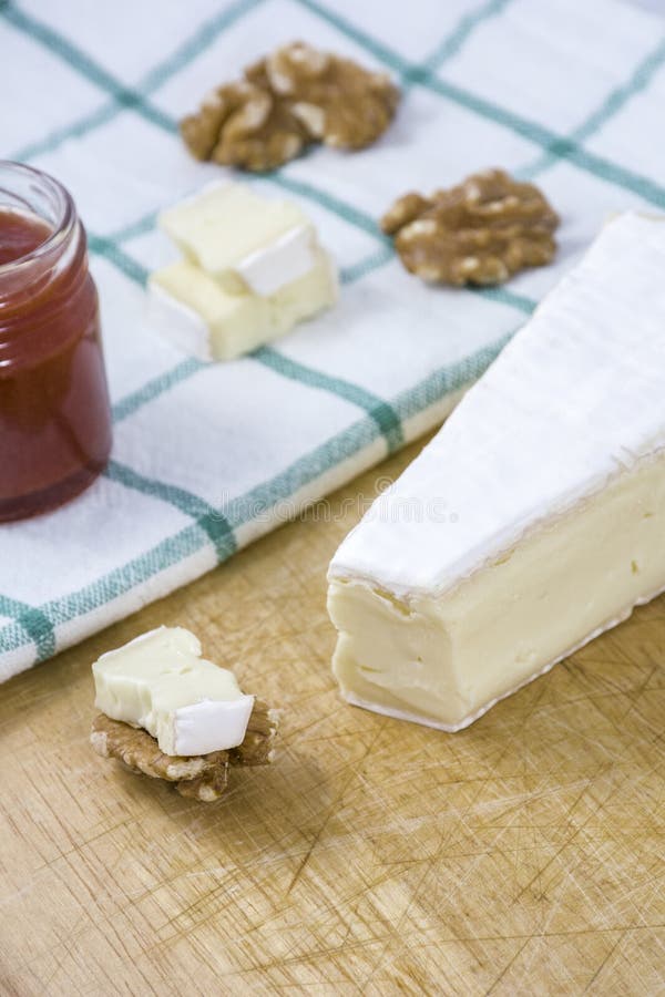 Tasty brie cheese with nuts, jam royalty free stock photo Tasty brie cheese with nuts, jam royalty free stock photo