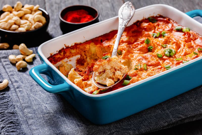 tasty Cauliflower casserole in a blue baking dish stock photo
