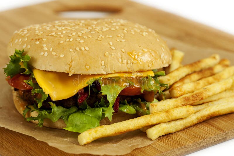 Tasty cheeseburger with fries