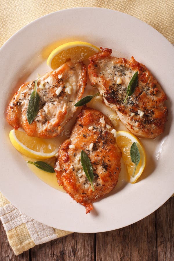 Tasty Chicken Steaks with Sage, Lemon and Garlic Sauce Closeup. Stock