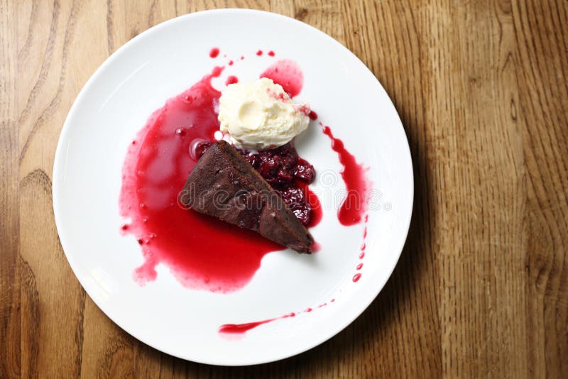 Chocolate brownie with raspberry sauce and ice cream royalty free stock photo Chocolate brownie with raspberry sauce and ice cream royalty free stock photo