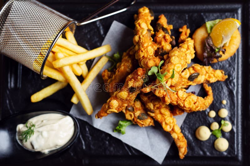 Tasty Crispy Chicken Wings. Dish for Dinner on Plate Stock Photo