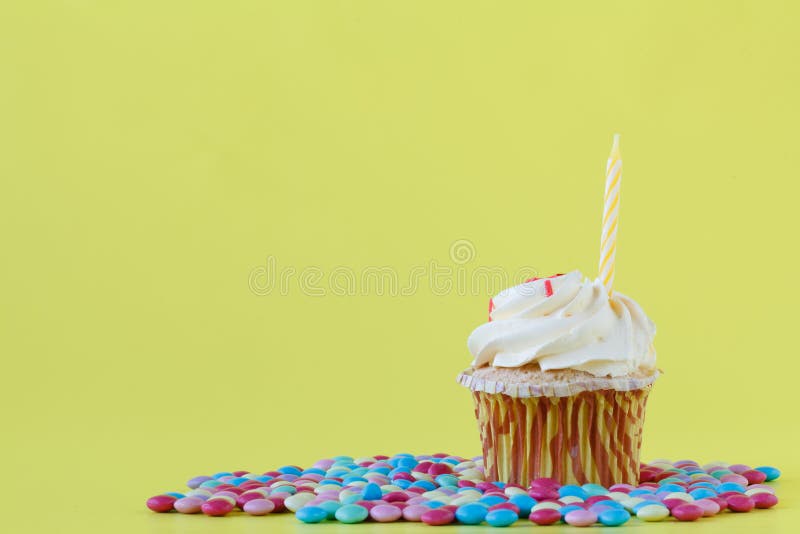 Tasty cupcakes with candles on colorful background royalty free stock photography Tasty cupcakes with candles on colorful background royalty free stock photography