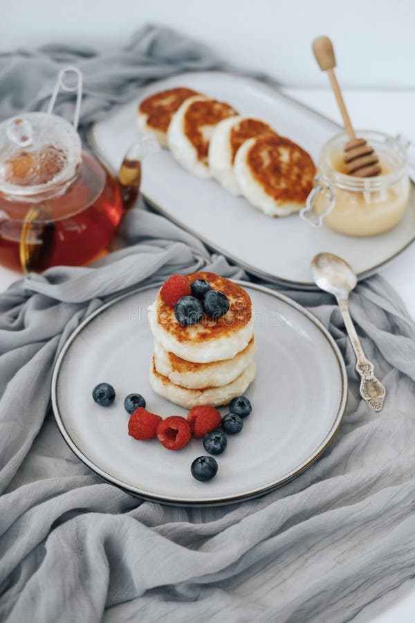 Tasty curd cheesecakes with berries on a plate